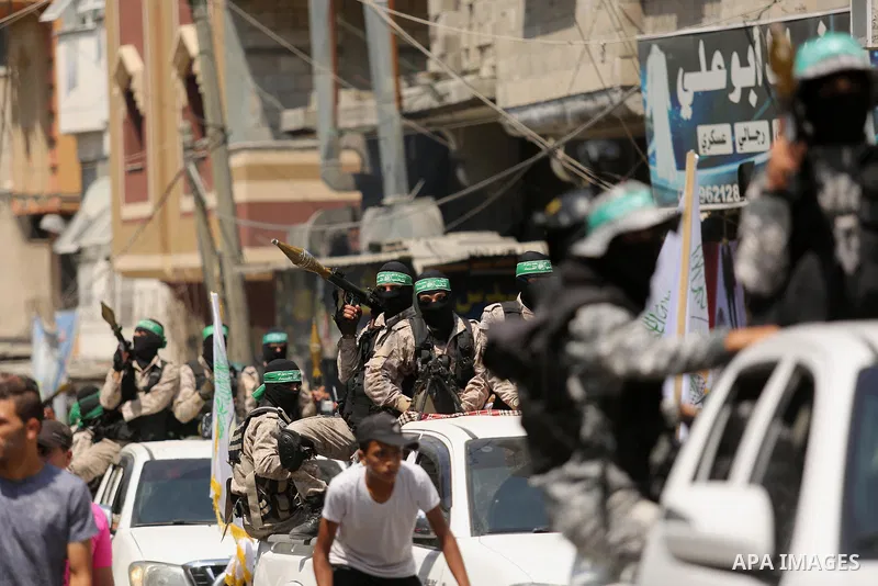 Palestinian Hamas militants take part in a protest against Israel's new security measures at the entrance to the al-Aqsa mosque compound, which include metal detectors and cameras, in Khan Younis in the the southern Gaza...