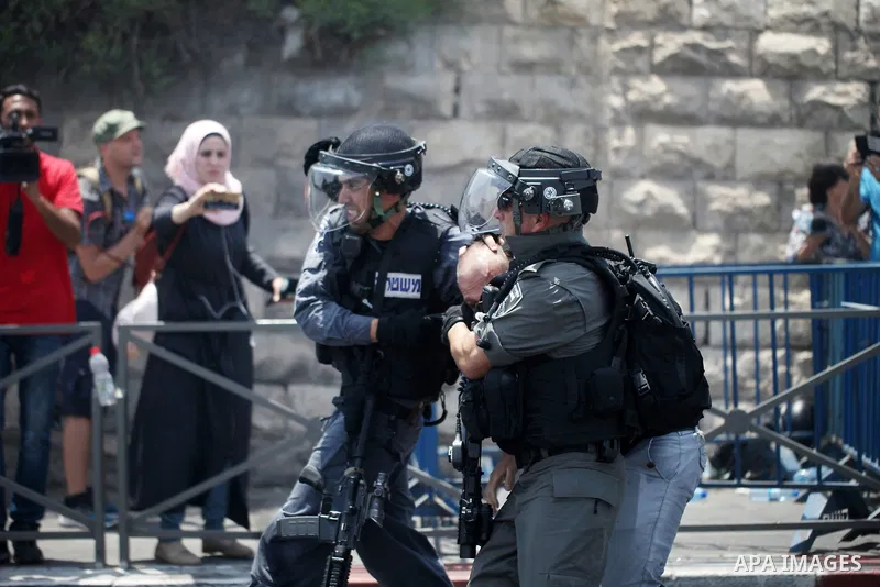 Israeli security forces detain a Palestinian protester during clashes following Friday prayer outside Jerusalem's Old City on July 21, 2017, after Israeli police barred men under 50 from entering the Old City for Friday...