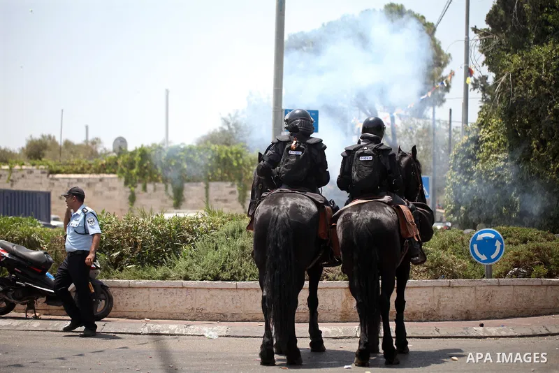 Horse mounted Israeli security forces patrol during clashes with Palestinian protesters following Friday prayer outside Jerusalem's Old City on July 21, 2017, after Israeli police barred men under 50 from entering the Ol...