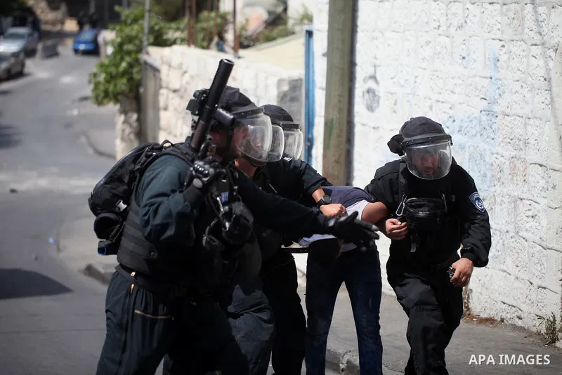 Israeli security forces detain a Palestinian protester during clashes following Friday prayer outside Jerusalem's Old City on July 21, 2017, after Israeli police barred men under 50 from entering the Old City for Friday...