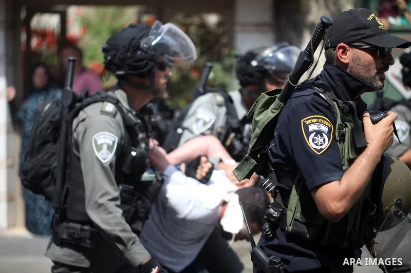 Israeli security forces detain a Palestinian protester during clashes following Friday prayer outside Jerusalem's Old City on July 21, 2017, after Israeli police barred men under 50 from entering the Old City for Friday...