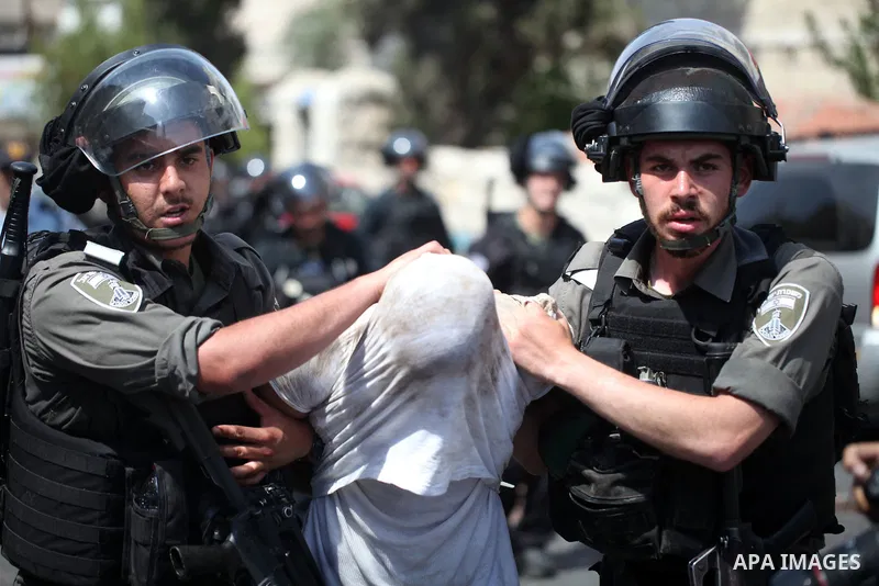 Israeli security forces detain a Palestinian protester during clashes following Friday prayer outside Jerusalem's Old City on July 21, 2017, after Israeli police barred men under 50 from entering the Old City for Friday...