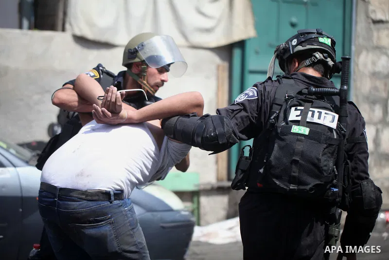 Israeli security forces detain a Palestinian protester during clashes following Friday prayer outside Jerusalem's Old City on July 21, 2017, after Israeli police barred men under 50 from entering the Old City for Friday...