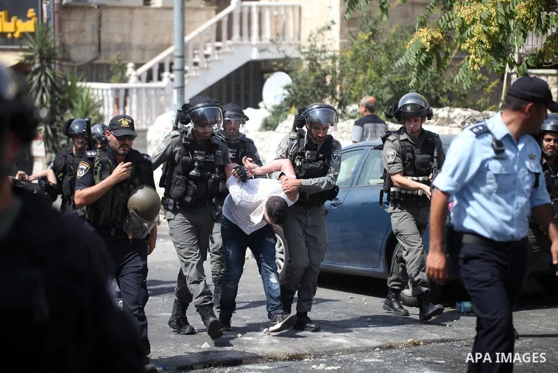 Israeli security forces detain a Palestinian protester during clashes following Friday prayer outside Jerusalem's Old City on July 21, 2017, after Israeli police barred men under 50 from entering the Old City for Friday...