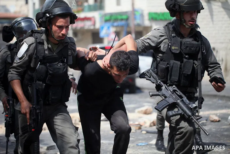 Israeli security forces detain a Palestinian protester during clashes following Friday prayer outside Jerusalem's Old City on July 21, 2017, after Israeli police barred men under 50 from entering the Old City for Friday...