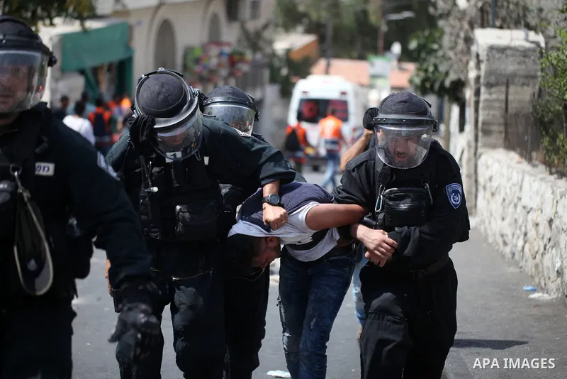 Israeli security forces detain a Palestinian protester during clashes following Friday prayer outside Jerusalem's Old City on July 21, 2017, after Israeli police barred men under 50 from entering the Old City for Friday...