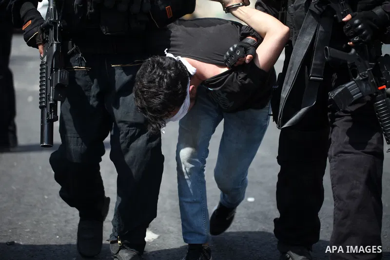 Israeli security forces detain a Palestinian protester during clashes following Friday prayer outside Jerusalem's Old City on July 21, 2017, after Israeli police barred men under 50 from entering the Old City for Friday...