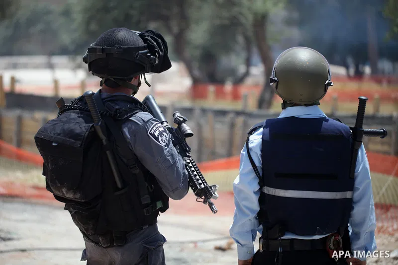 Israeli security forces take position during clashes with Palestinian protesters following Friday prayer outside Jerusalem's Old City on July 21, 2017, after Israeli police barred men under 50 from entering the Old City...