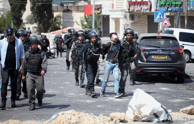 Israeli security forces detain a Palestinian protester during clashes following Friday prayer outside Jerusalem's Old City on July 21, 2017, after Israeli police barred men under 50 from entering the Old City for Friday...