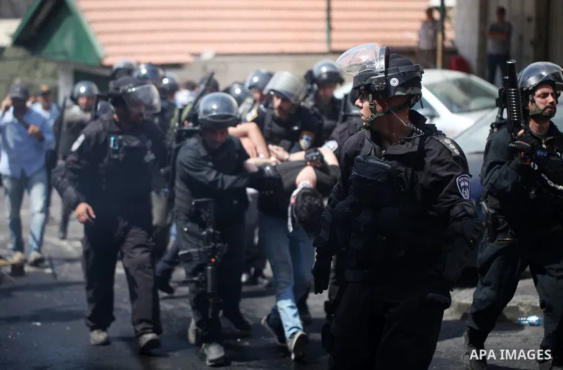 Israeli security forces detain a Palestinian protester during clashes following Friday prayer outside Jerusalem's Old City on July 21, 2017, after Israeli police barred men under 50 from entering the Old City for Friday...