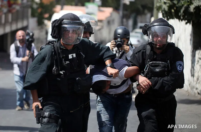Israeli security forces detain a Palestinian protester during clashes following Friday prayer outside Jerusalem's Old City on July 21, 2017, after Israeli police barred men under 50 from entering the Old City for Friday...
