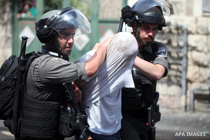 Israeli security forces detain a Palestinian protester during clashes following Friday prayer outside Jerusalem's Old City on July 21, 2017, after Israeli police barred men under 50 from entering the Old City for Friday...