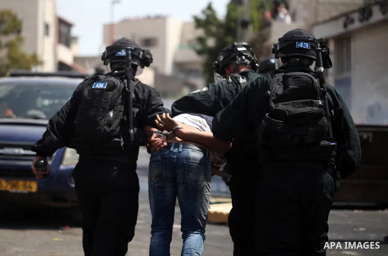 Israeli security forces detain a Palestinian protester during clashes following Friday prayer outside Jerusalem's Old City on July 21, 2017, after Israeli police barred men under 50 from entering the Old City for Friday...