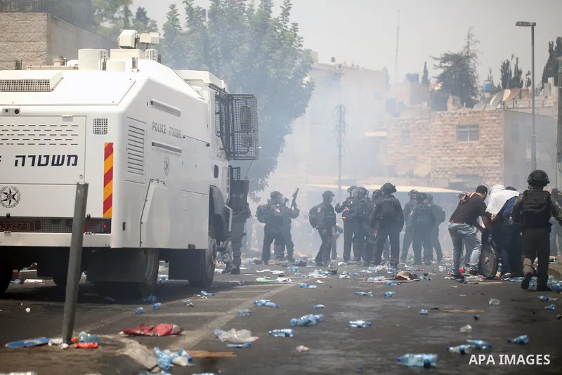 Israeli security forces take position during clashes with Palestinian protesters following Friday prayer outside Jerusalem's Old City on July 21, 2017, after Israeli police barred men under 50 from entering the Old City...