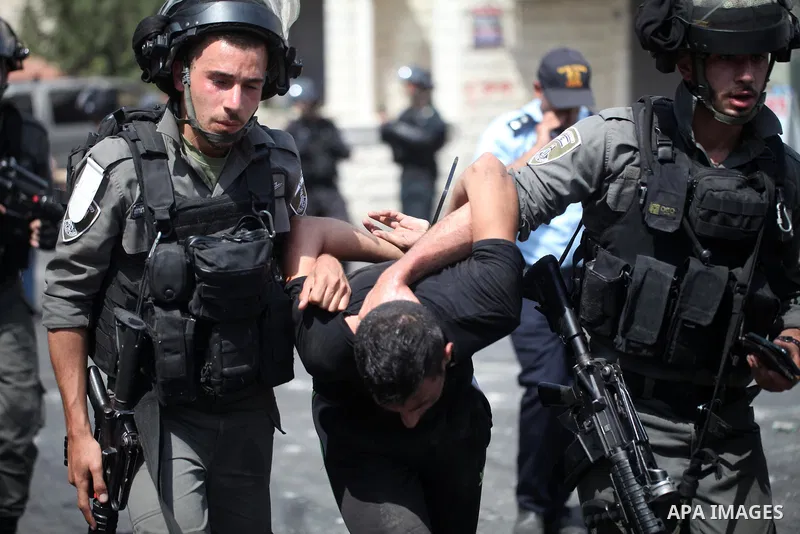 Israeli security forces detain a Palestinian protester during clashes following Friday prayer outside Jerusalem's Old City on July 21, 2017, after Israeli police barred men under 50 from entering the Old City for Friday...