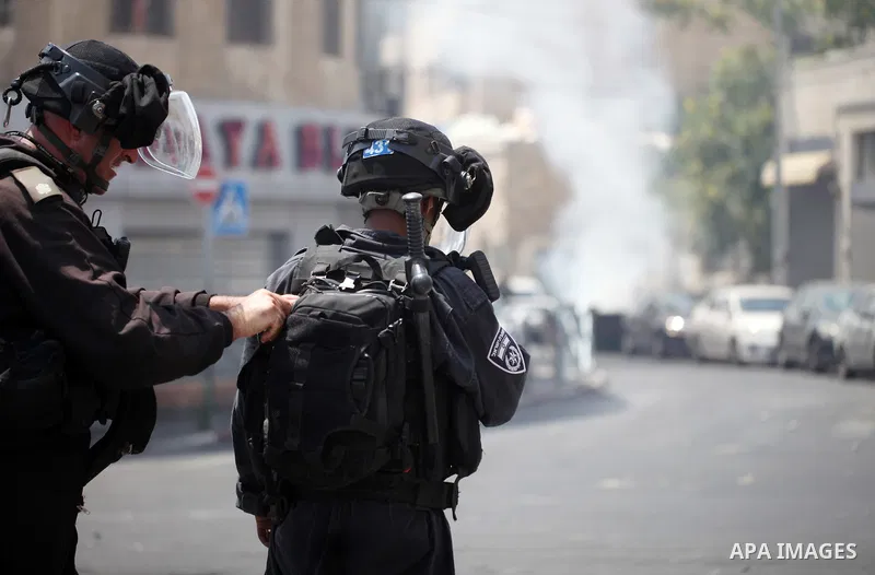 Israeli security forces take position during clashes with Palestinian protesters following Friday prayer outside Jerusalem's Old City on July 21, 2017, after Israeli police barred men under 50 from entering the Old City...