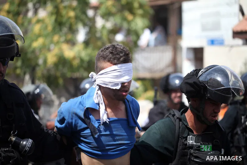 Israeli security forces detain a Palestinian protester during clashes following Friday prayer outside Jerusalem's Old City on July 21, 2017, after Israeli police barred men under 50 from entering the Old City for Friday...