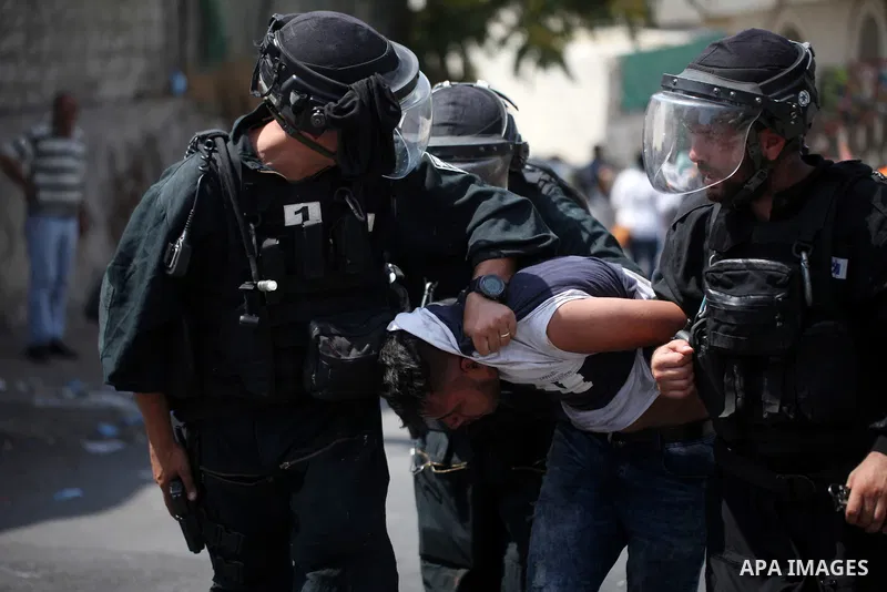 Israeli security forces detain a Palestinian protester during clashes following Friday prayer outside Jerusalem's Old City on July 21, 2017, after Israeli police barred men under 50 from entering the Old City for Friday...