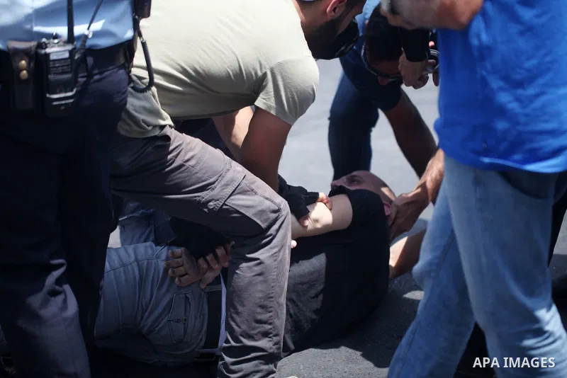 Israeli security forces detain a Palestinian protester during clashes following Friday prayer outside Jerusalem's Old City on July 21, 2017, after Israeli police barred men under 50 from entering the Old City for Friday...