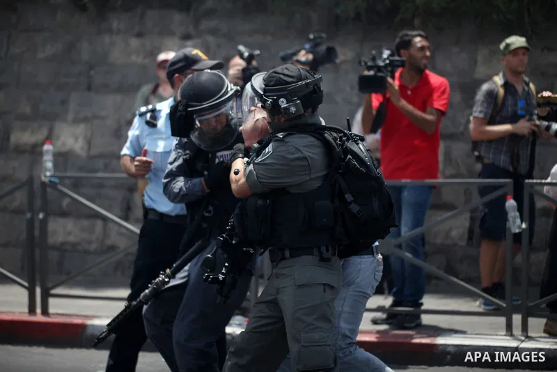 Israeli security forces detain a Palestinian protester during clashes following Friday prayer outside Jerusalem's Old City on July 21, 2017, after Israeli police barred men under 50 from entering the Old City for Friday...