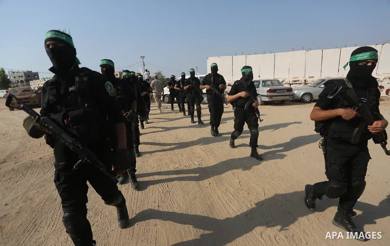 Palestinian Hamas militants take part in a military show against Israel's new security measures at the entrance to the al-Aqsa mosque compound, which include metal detectors and cameras, in Gaza city on July 21, 2017. Ph...