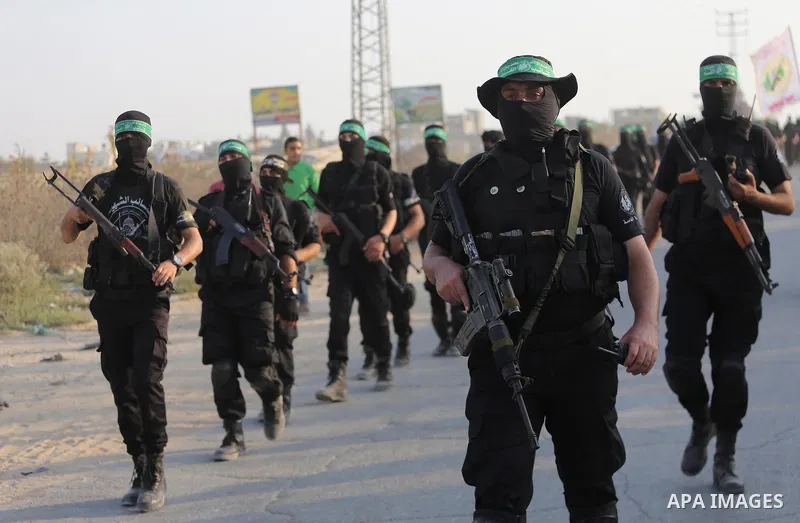 Palestinian Hamas militants take part in a military show against Israel's new security measures at the entrance to the al-Aqsa mosque compound, which include metal detectors and cameras, in Gaza city on July 21, 2017. Ph...