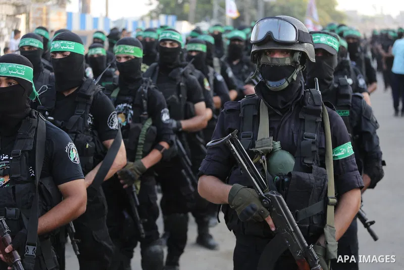 Palestinian Hamas militants take part in a military show against Israel's new security measures at the entrance to the al-Aqsa mosque compound, which include metal detectors and cameras, in Gaza city on July 21, 2017. Ph...