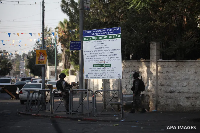 Israeli security forces take position during clashes with Palestinian protesters following Friday prayer outside Jerusalem's Old City on July 21, 2017, after Israeli police barred men under 50 from entering the Old City...