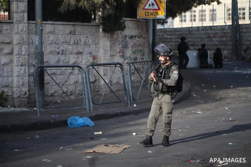 Israeli security forces take position during clashes with Palestinian protesters following Friday prayer outside Jerusalem's Old City on July 21, 2017, after Israeli police barred men under 50 from entering the Old City...