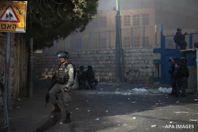Israeli security forces take position during clashes with Palestinian protesters following Friday prayer outside Jerusalem's Old City on July 21, 2017, after Israeli police barred men under 50 from entering the Old City...