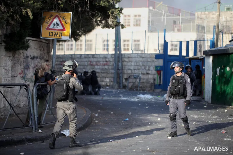 Israeli security forces take position during clashes with Palestinian protesters following Friday prayer outside Jerusalem's Old City on July 21, 2017, after Israeli police barred men under 50 from entering the Old City...