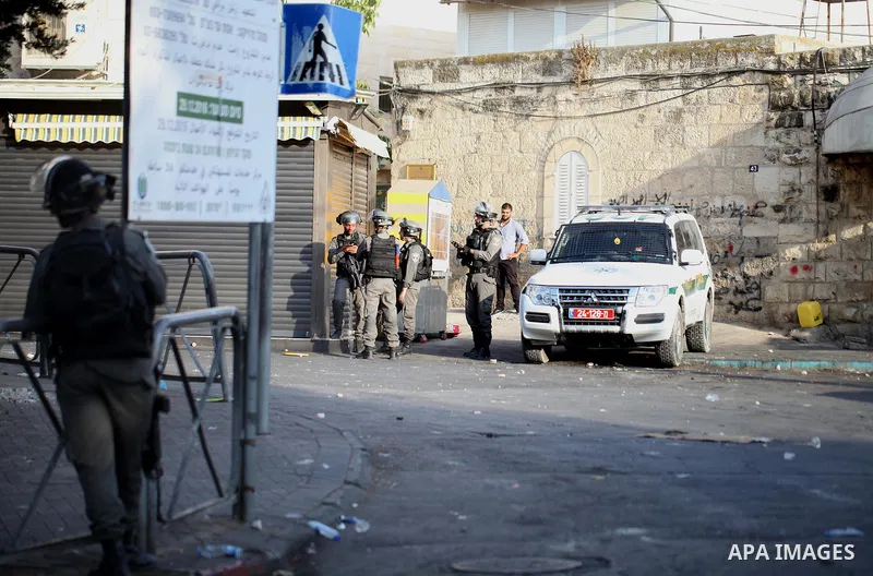 Israeli security forces take position during clashes with Palestinian protesters following Friday prayer outside Jerusalem's Old City on July 21, 2017, after Israeli police barred men under 50 from entering the Old City...