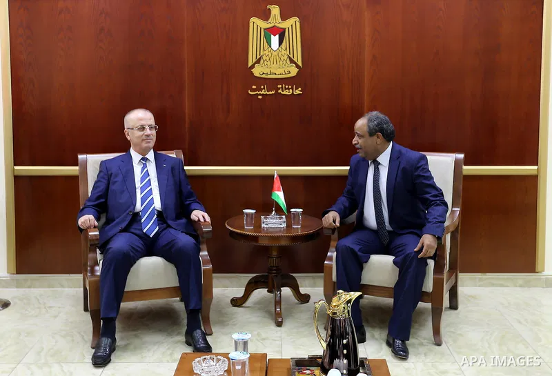 Palestinian Prime Minister Rami Hamdallah meets with governor of Salfit governorate Ibrahim al-Balawi, in the West Bank city of Salfit on July 22, 2017. Photo by Prime Minister Office