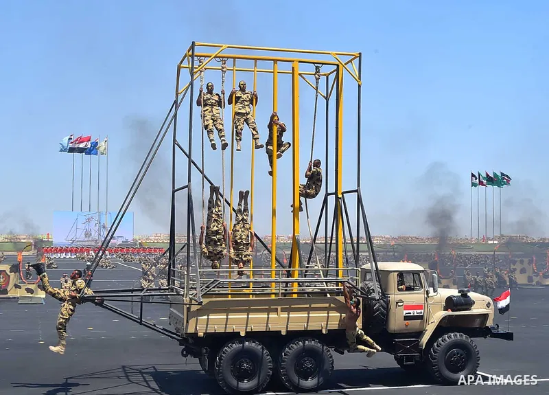 Military students display their training to mark the opening of the Mohamed Najib military base, the graduation of new graduates from military colleges, and the celebration of the 65th anniversary of the July 23 revoluti...