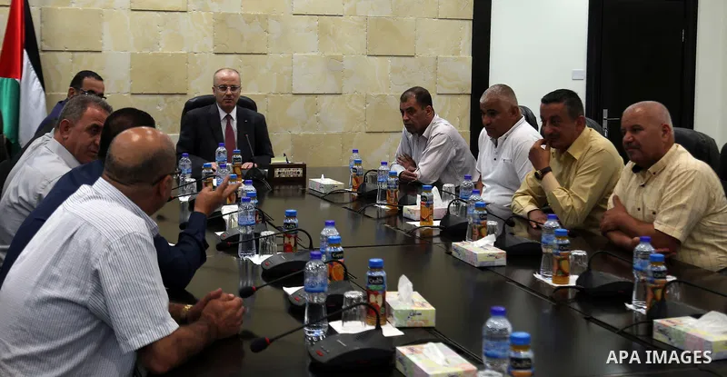 Palestinian Prime Minister, Rami Hamdallah, meets with member of the representatives of the Popular Committees for Camps, in the West Bank city of Ramallah, on July 23, 2017. Photo by Prime Minister Office