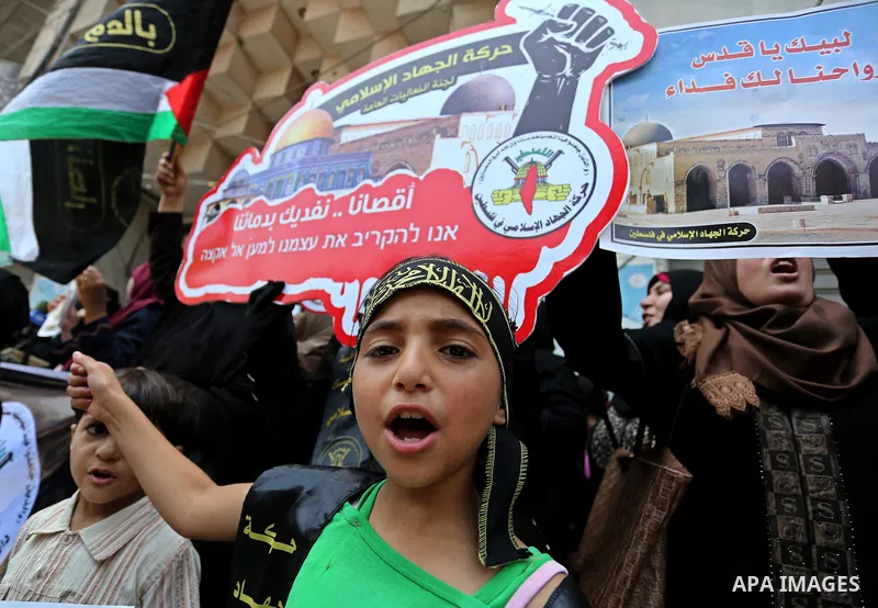 Palestinian supporters of Islamic Jihad take part in a protest against Israel's new security measures at the entrance to the al-Aqsa mosque compound, which include metal detectors and cameras, in Gaza City on July 23, 20...