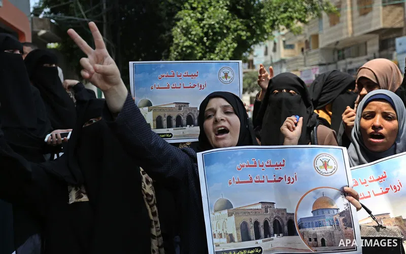 Palestinian supporters of Islamic Jihad take part in a protest against Israel's new security measures at the entrance to the al-Aqsa mosque compound, which include metal detectors and cameras, in Gaza City on July 23, 20...