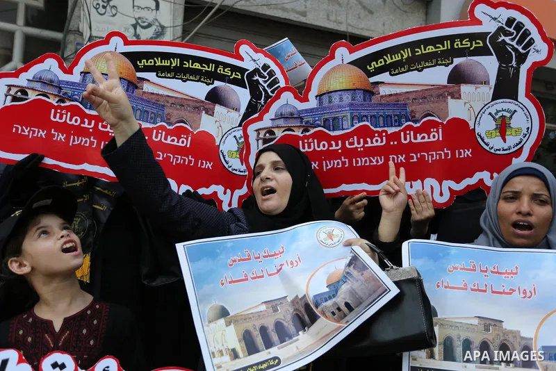 Palestinian supporters of Islamic Jihad take part in a protest against Israel's new security measures at the entrance to the al-Aqsa mosque compound, which include metal detectors and cameras, in Gaza City on July 23, 20...