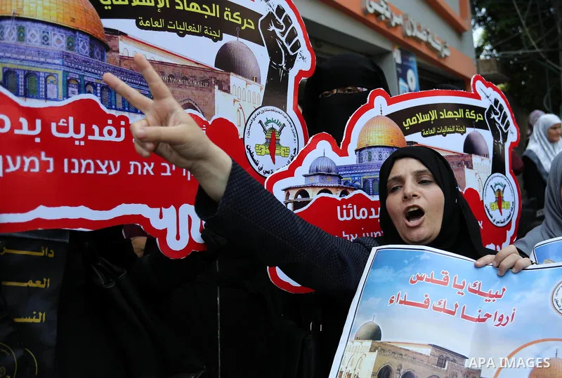 Palestinian supporters of Islamic Jihad take part in a protest against Israel's new security measures at the entrance to the al-Aqsa mosque compound, which include metal detectors and cameras, in Gaza City on July 23, 20...