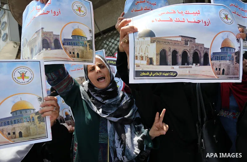 Palestinian supporters of Islamic Jihad take part in a protest against Israel's new security measures at the entrance to the al-Aqsa mosque compound, which include metal detectors and cameras, in Gaza City on July 23, 20...
