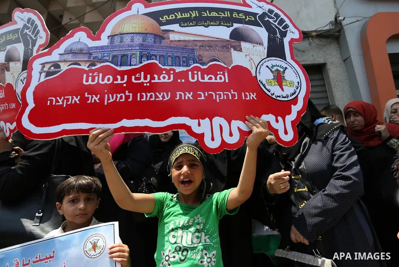 Palestinian supporters of Islamic Jihad take part in a protest against Israel's new security measures at the entrance to the al-Aqsa mosque compound, which include metal detectors and cameras, in Gaza City on July 23, 20...