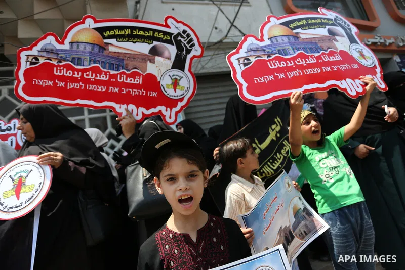 Palestinian supporters of Islamic Jihad take part in a protest against Israel's new security measures at the entrance to the al-Aqsa mosque compound, which include metal detectors and cameras, in Gaza City on July 23, 20...