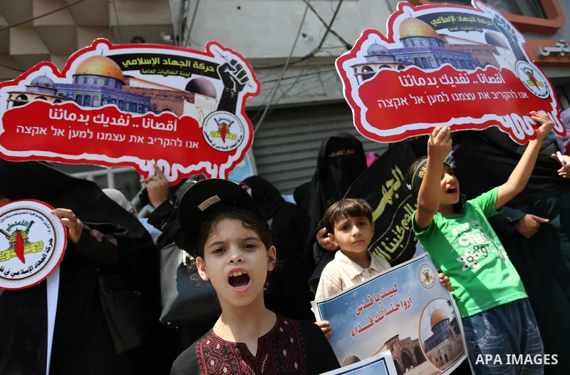 Palestinian supporters of Islamic Jihad take part in a protest against Israel's new security measures at the entrance to the al-Aqsa mosque compound, which include metal detectors and cameras, in Gaza City on July 23, 20...