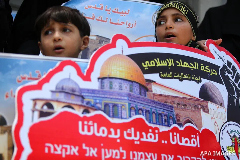 Palestinian supporters of Islamic Jihad take part in a protest against Israel's new security measures at the entrance to the al-Aqsa mosque compound, which include metal detectors and cameras, in Gaza City on July 23, 20...