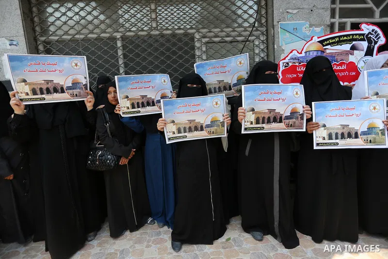 Palestinian supporters of Islamic Jihad take part in a protest against Israel's new security measures at the entrance to the al-Aqsa mosque compound, which include metal detectors and cameras, in Gaza City on July 23, 20...