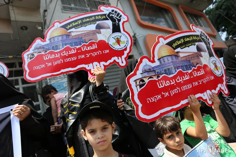 Palestinian supporters of Islamic Jihad take part in a protest against Israel's new security measures at the entrance to the al-Aqsa mosque compound, which include metal detectors and cameras, in Gaza City on July 23, 20...