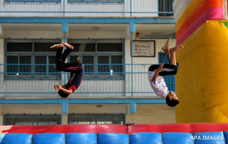 Palestinian children enjoy as part of the activities proposed during a Summer Fun Weeks 2017 organised by the United Nations, in Jabalia refugee camp in the northern Gaza strip, on July 23, 2017. Photo by Ashraf Amra