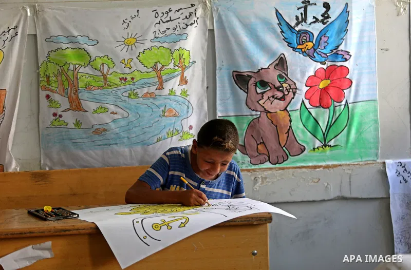 Palestinian children enjoy as part of the activities proposed during a Summer Fun Weeks 2017 organised by the United Nations, in Jabalia refugee camp in the northern Gaza strip, on July 23, 2017. Photo by Ashraf Amra