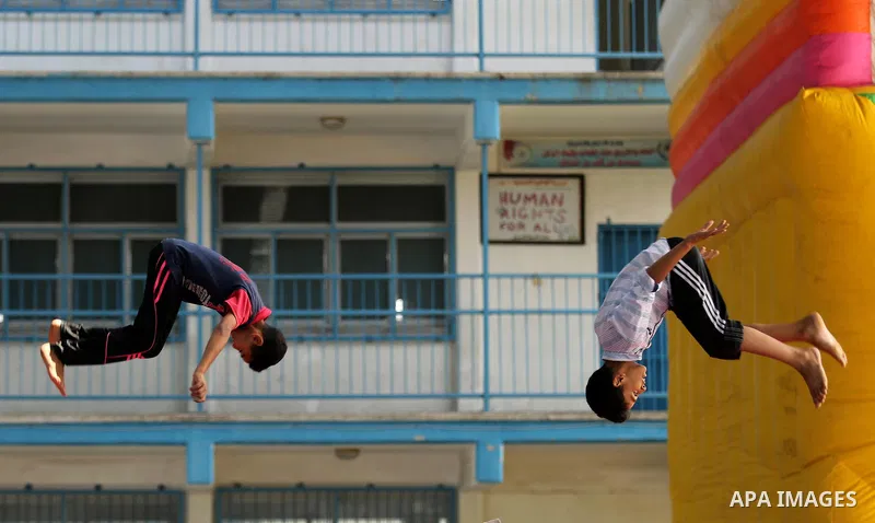 Palestinian children enjoy as part of the activities proposed during a Summer Fun Weeks 2017 organised by the United Nations, in Jabalia refugee camp in the northern Gaza strip, on July 23, 2017. Photo by Ashraf Amra