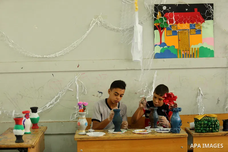 Palestinian children enjoy as part of the activities proposed during a Summer Fun Weeks 2017 organised by the United Nations, in Jabalia refugee camp in the northern Gaza strip, on July 23, 2017. Photo by Ashraf Amra